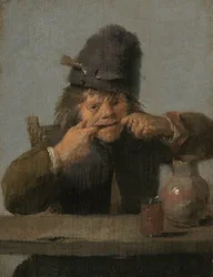 顔を作る若者